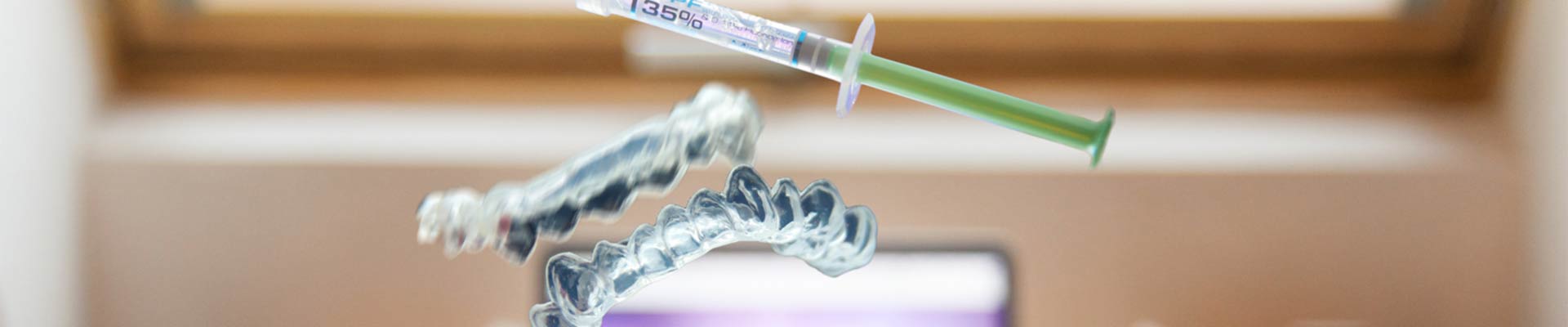 Dental tooth whitening trays with whitening compound